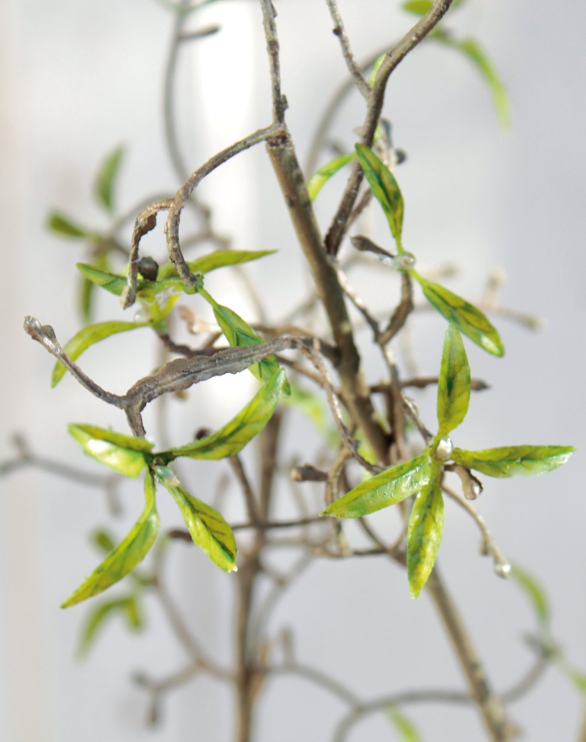 Artificial decorative twig with delicate leaves, 122 cm, green