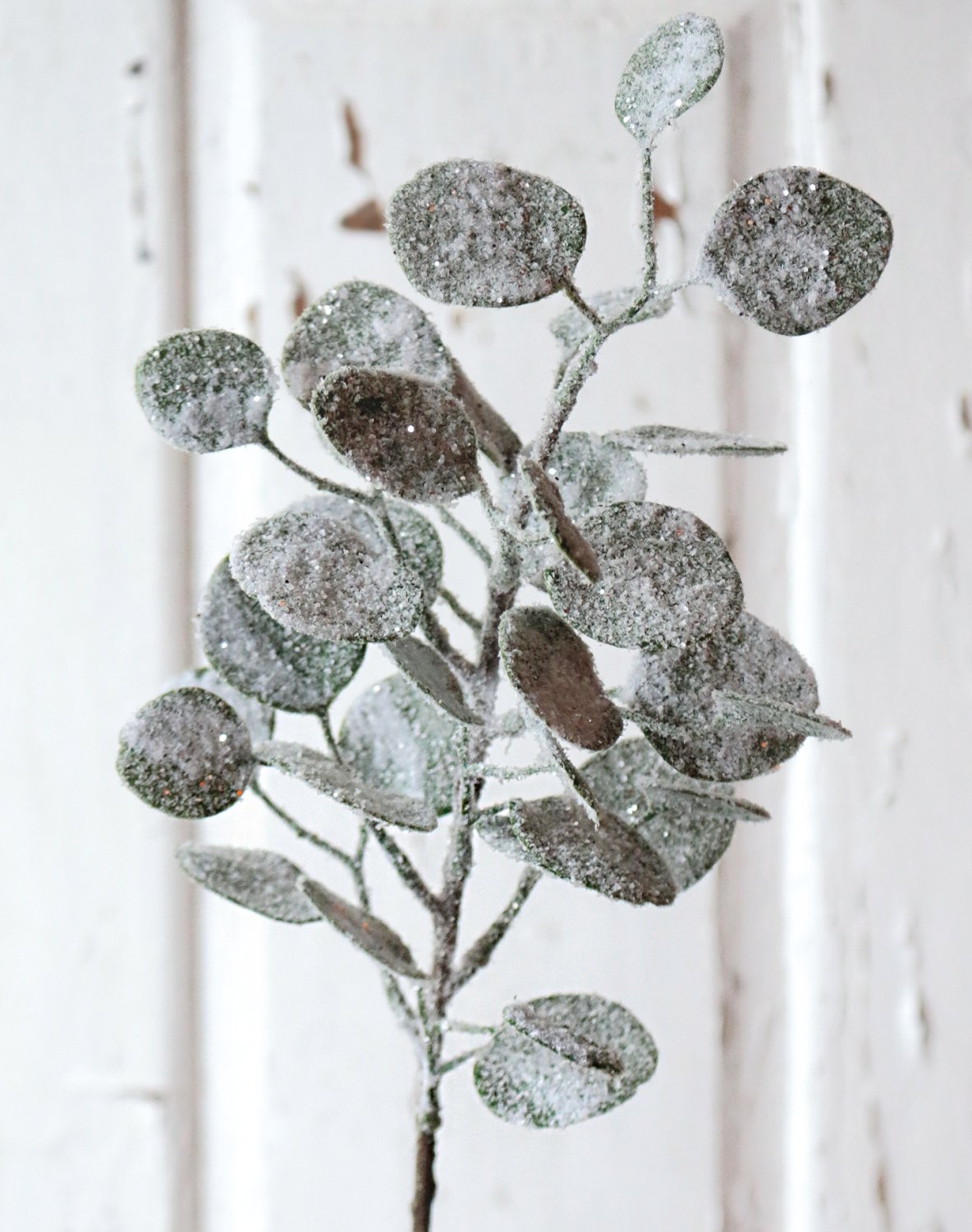 Faux eucalyptus stem with snow, 45 cm, frosted green