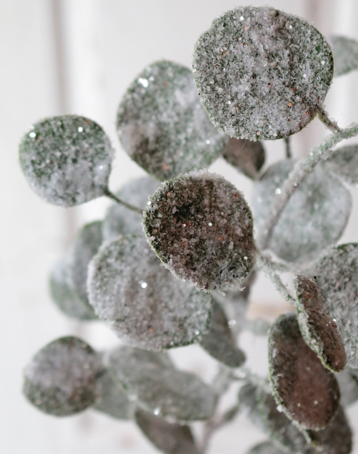 Faux eucalyptus stem with snow, 45 cm, frosted green