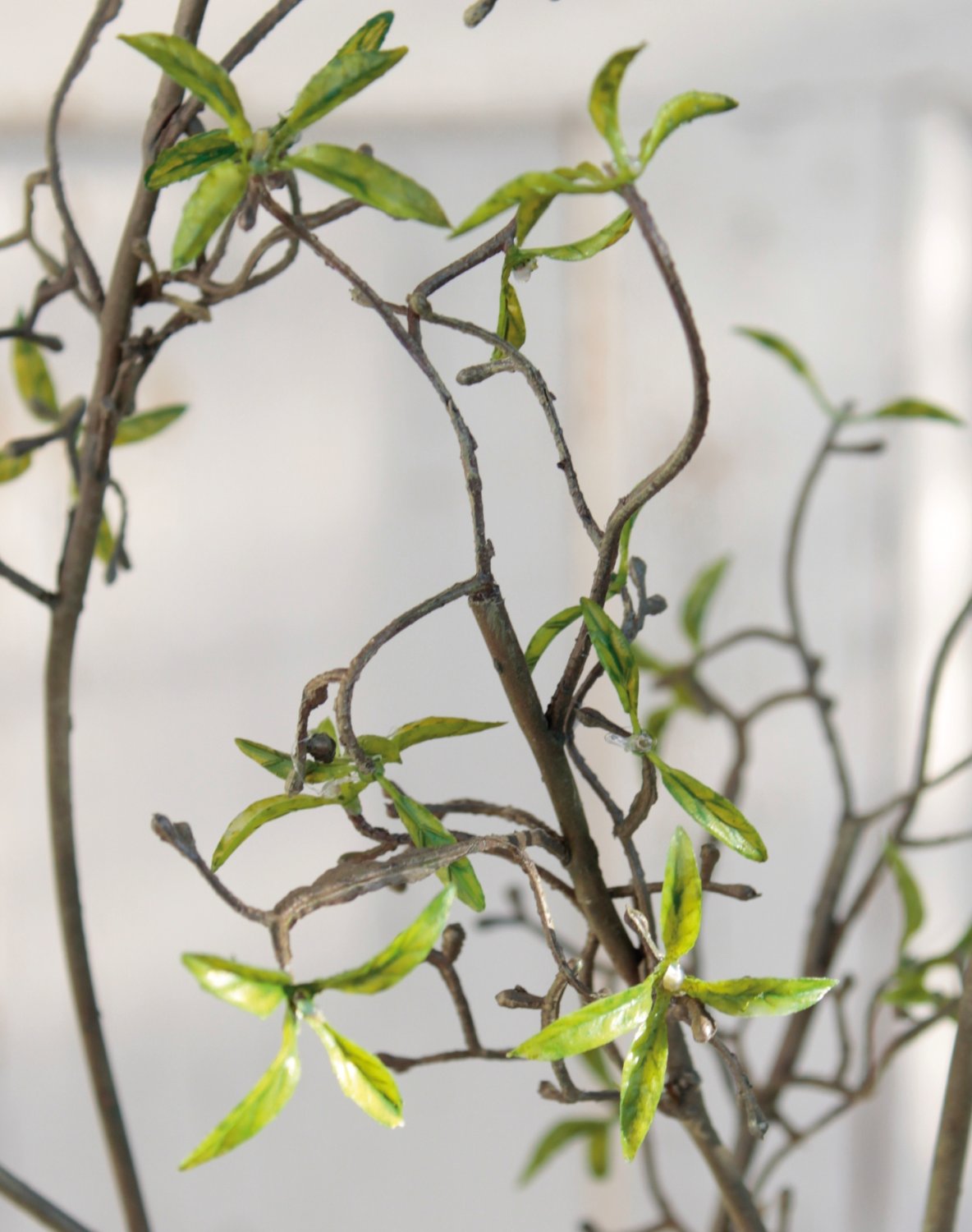 Artificial decorative twig with delicate leaves, 122 cm, green