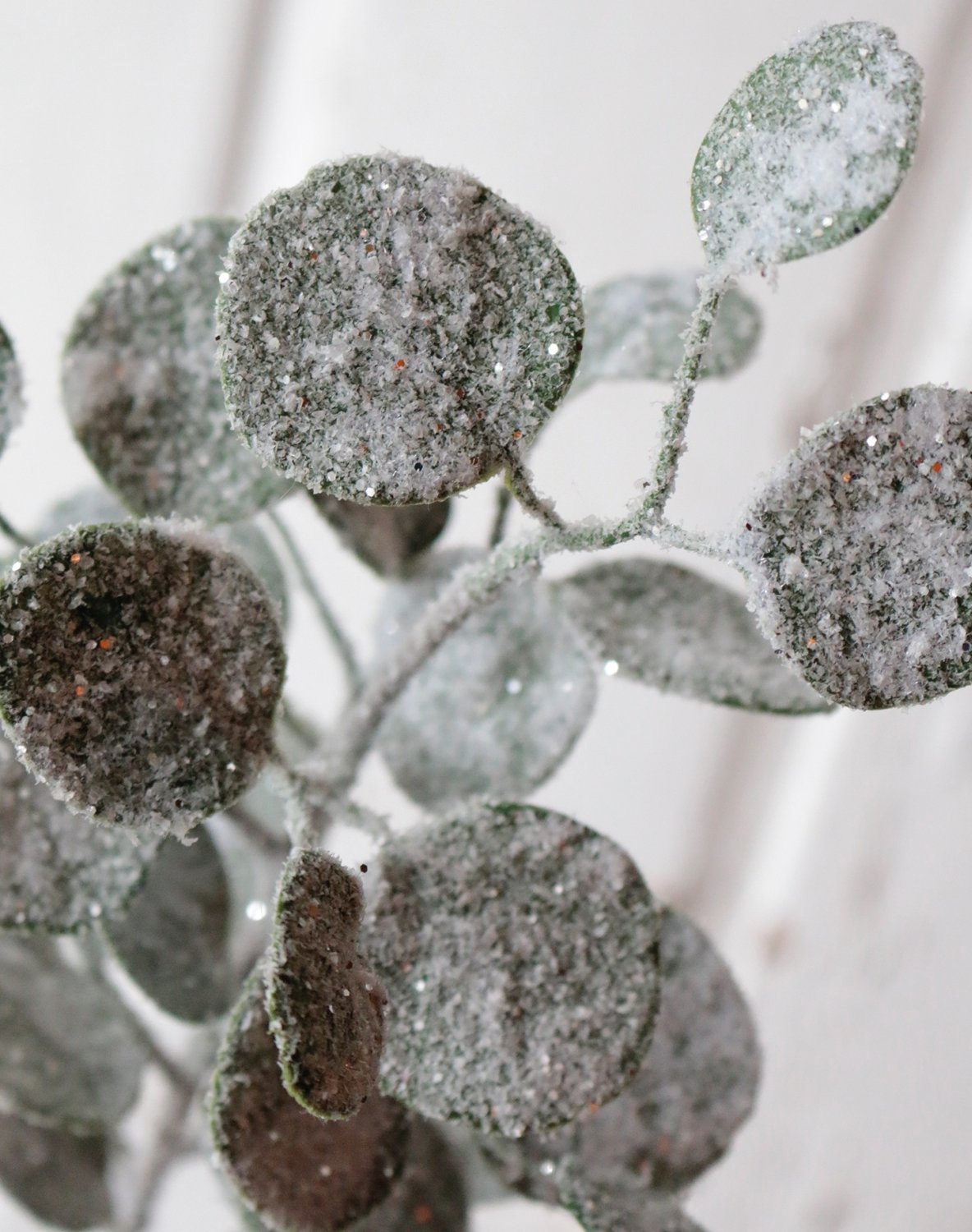 Faux eucalyptus stem with snow, 45 cm, frosted green