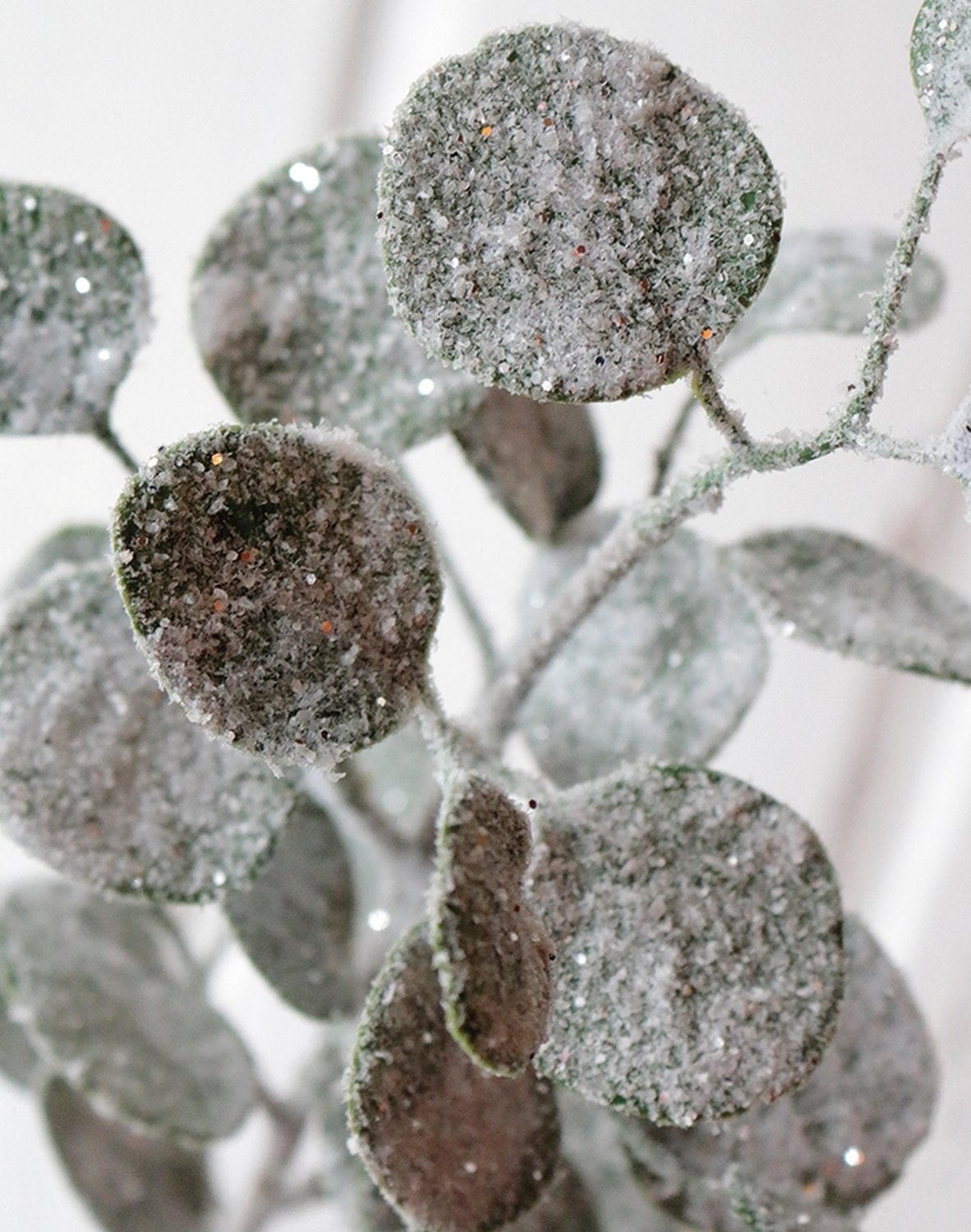 Faux eucalyptus stem with snow, 45 cm, frosted green